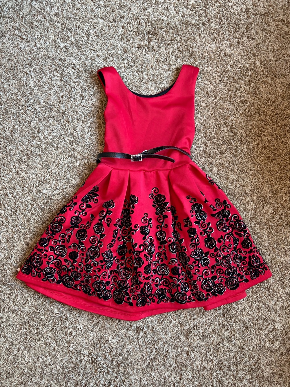 Girls Knitworks red dress with black rose accents, faux fur jacket, and belt